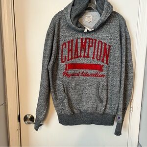 Champion men’s gray hoodie, embroidered letters on front and kangaroo pockets.
